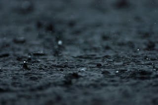 Rain on pavement close up