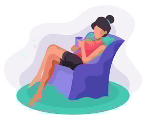 Woman relaxing in recliner with tea