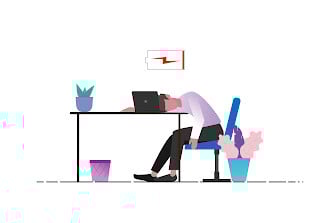 man sleeping at a desk